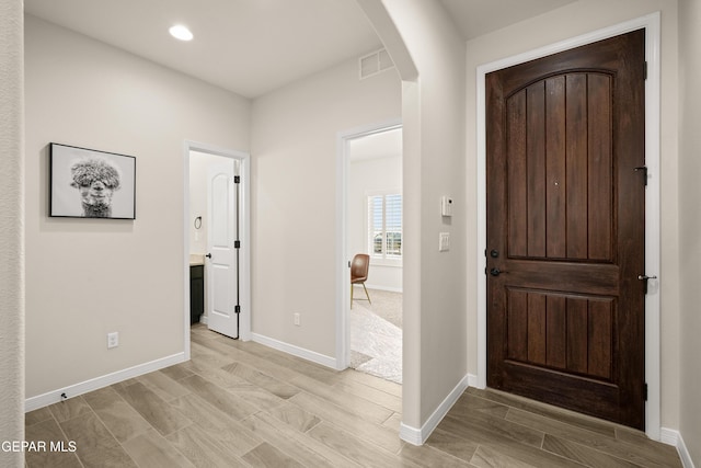 14924 Hill Ridge Ct, El Paso, TX 79938 - foyer with arched walkways, recessed lighting, and light wood-style flooring