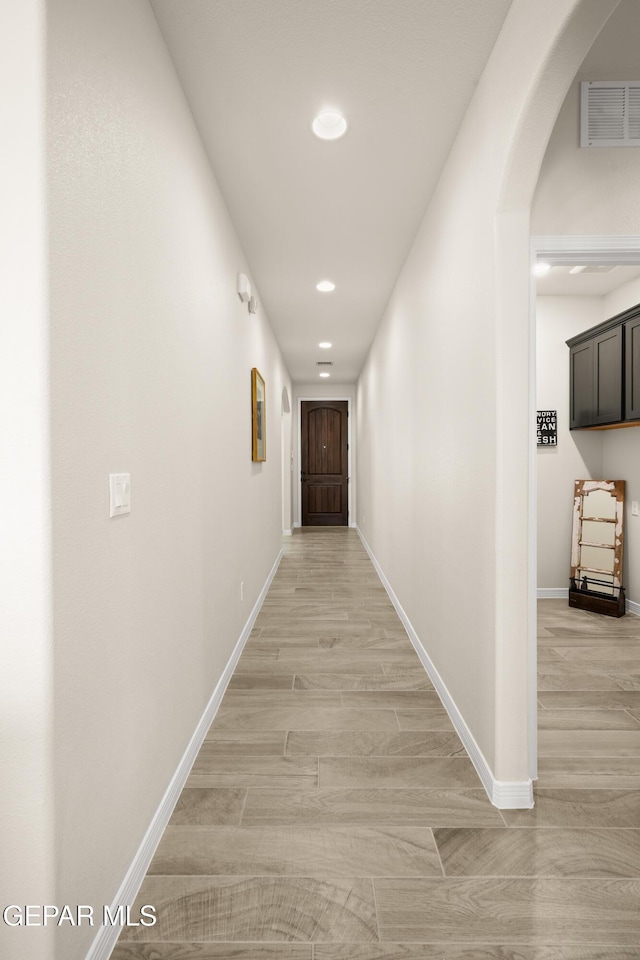 14924 Hill Ridge Ct, El Paso, TX 79938 - corridor featuring recessed lighting, arched walkways, and light wood-style flooring