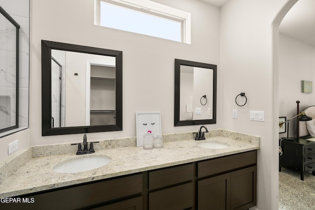 14924 Hill Ridge Ct, El Paso, TX 79938 - bathroom featuring double vanity and a shower with shower door
