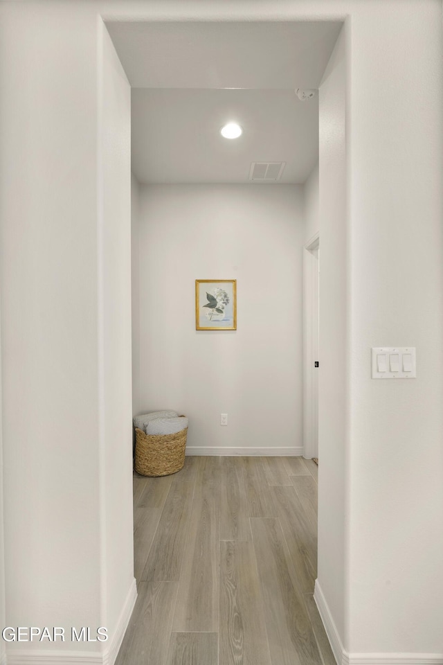 14932 Hill Ridge Ct, El Paso, TX 79938 - hallway with light wood finished floors, baseboards, and recessed lighting