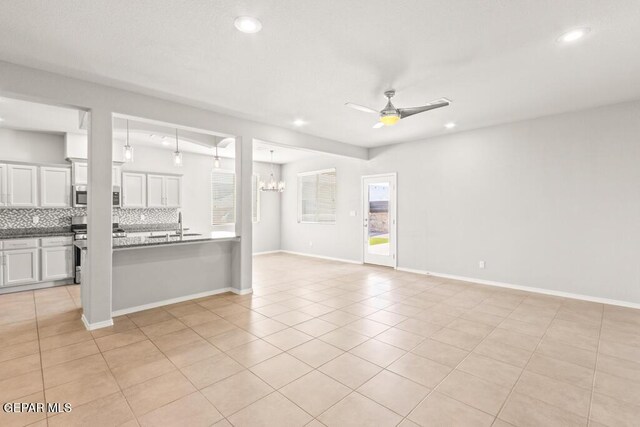 14270 Don Johnson, El Paso, TX 79938 - unfurnished room featuring ceiling fan, recessed lighting, a chandelier, light tile patterned flooring, and a sink
