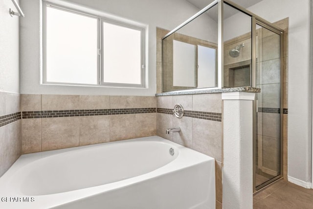 14270 Don Johnson, El Paso, TX 79938 - full bathroom with a bath, a shower stall, and tile patterned floors