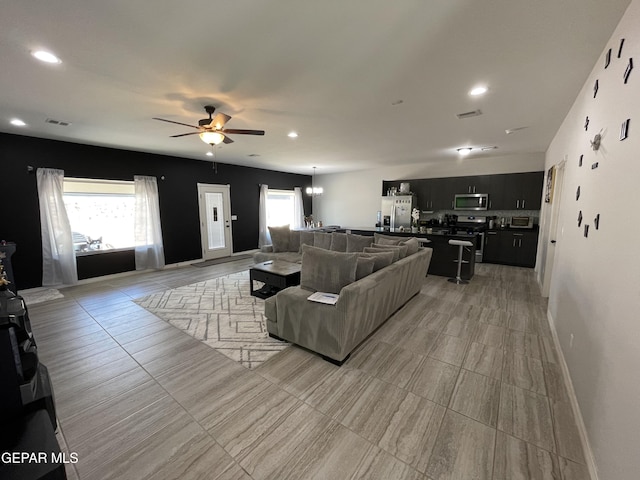 13689 Bradford St, El Paso, TX 79928 - living area featuring ceiling fan, plenty of natural light, recessed lighting, and baseboards