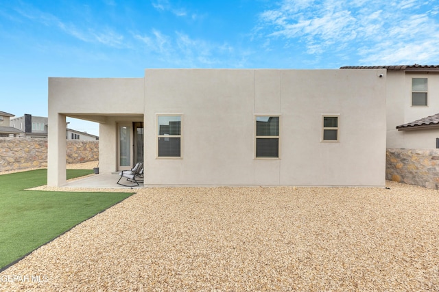 281 Farnborough St, Horizon City, TX 79928 - rear view of house with stucco siding and a patio