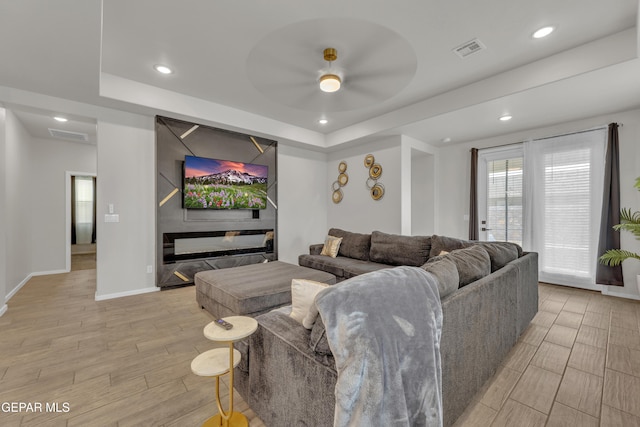 281 Farnborough St, Horizon City, TX 79928 - living room featuring recessed lighting, a raised ceiling, light wood-type flooring, baseboards, and a ceiling fan