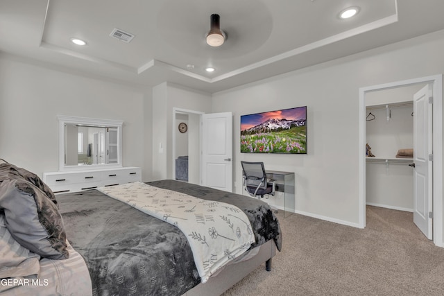 281 Farnborough St, Horizon City, TX 79928 - bedroom featuring a tray ceiling, carpet floors, recessed lighting, a walk in closet, and a closet