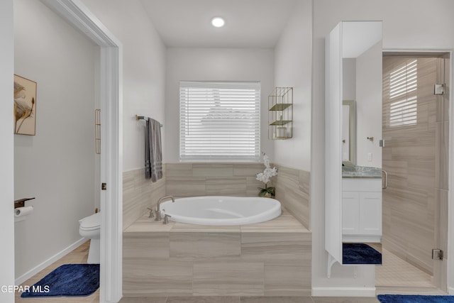 281 Farnborough St, Horizon City, TX 79928 - full bathroom with a garden tub, vanity, toilet, a shower stall, and tile patterned floors