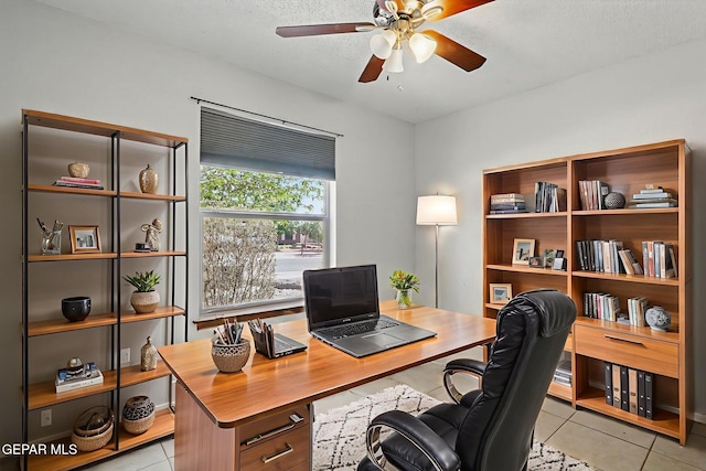 7721 Maya Ave, El Paso, TX 79912 - office with light tile patterned floors, ceiling fan, and a textured ceiling