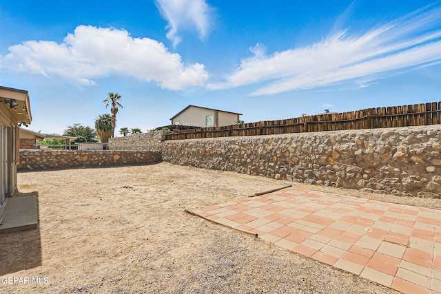 7721 Maya Ave, El Paso, TX 79912 - fenced backyard featuring a patio area