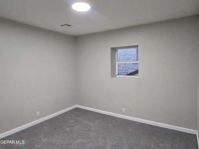 2917 Mobile Ave, El Paso, TX 79930 - spare room featuring dark colored carpet and baseboards