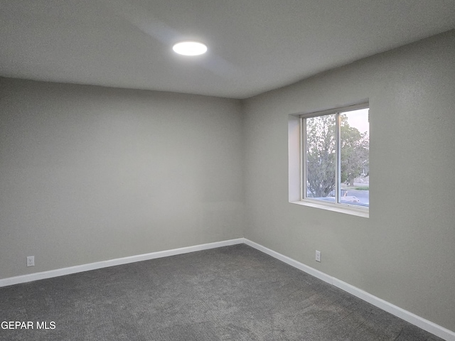 2917 Mobile Ave, El Paso, TX 79930 - spare room featuring baseboards and dark colored carpet