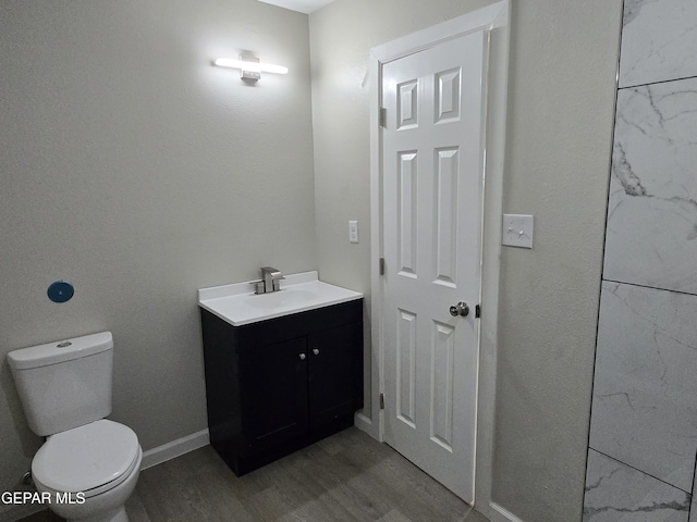 2917 Mobile Ave, El Paso, TX 79930 - bathroom featuring vanity and wood finished floors