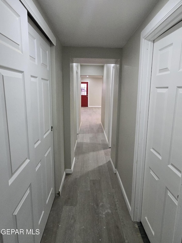 2917 Mobile Ave, El Paso, TX 79930 - corridor with baseboards and wood finished floors