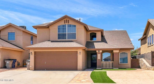 5429 Santiago Roque Dr, El Paso, TX 79934 - view of front of house featuring concrete driveway, stucco siding, a garage, a porch, and roof with shingles