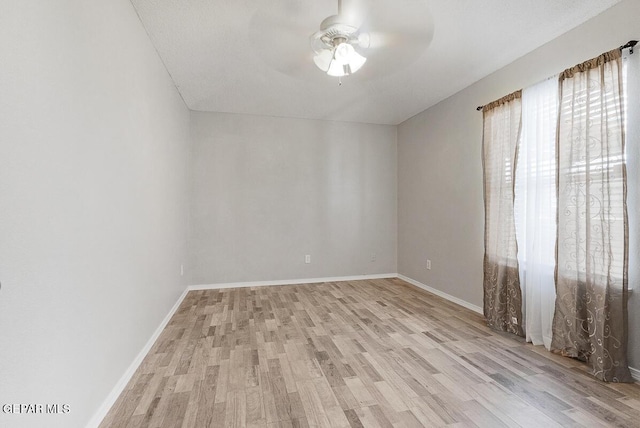 5429 Santiago Roque Dr, El Paso, TX 79934 - spare room featuring a ceiling fan, light wood-style flooring, and baseboards