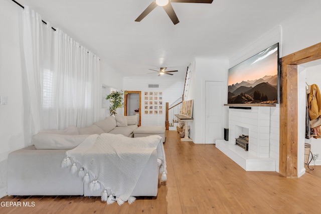305 N Carolina Dr, El Paso, TX 79915 - living room with a ceiling fan, stairs, and light wood-style flooring