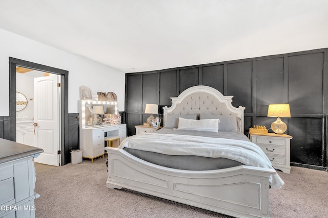 305 N Carolina Dr, El Paso, TX 79915 - bedroom with light colored carpet and a decorative wall