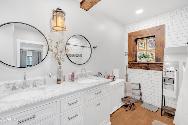 305 N Carolina Dr, El Paso, TX 79915 - full bath featuring double vanity and wood finished floors