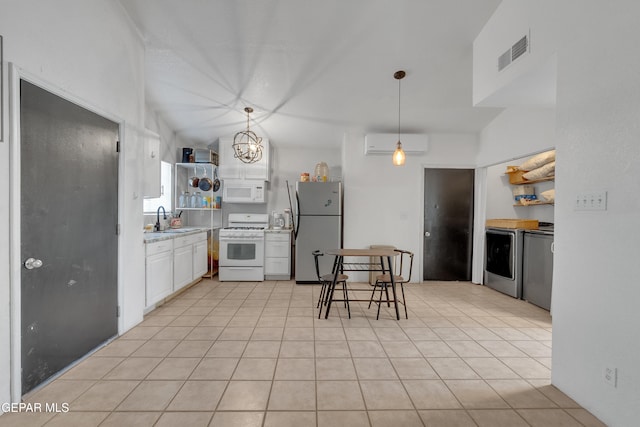 305 N Carolina Dr, El Paso, TX 79915 - kitchen with white appliances, a wall mounted AC, a sink, light countertops, and white cabinets