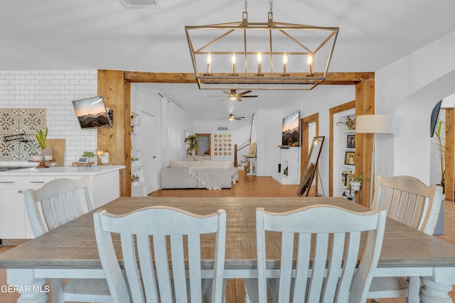 305 N Carolina Dr, El Paso, TX 79915 - dining space with a ceiling fan, arched walkways, and a chandelier