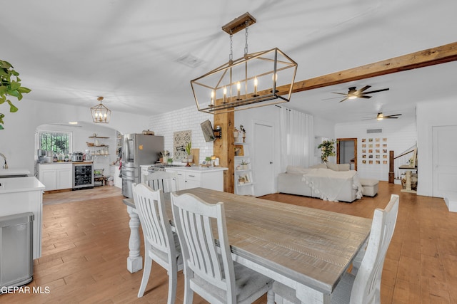 305 N Carolina Dr, El Paso, TX 79915 - dining space featuring a chandelier, light wood finished floors, a ceiling fan, and wine cooler