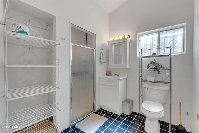 305 N Carolina Dr, El Paso, TX 79915 - bathroom featuring vanity, a stall shower, toilet, and tile patterned flooring