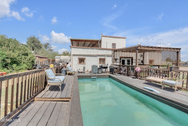 305 N Carolina Dr, El Paso, TX 79915 - outdoor pool featuring a wooden deck and a pergola