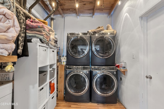 305 N Carolina Dr, El Paso, TX 79915 - laundry room with estacked washer and dryer, wood finished floors, and separate washer and dryer