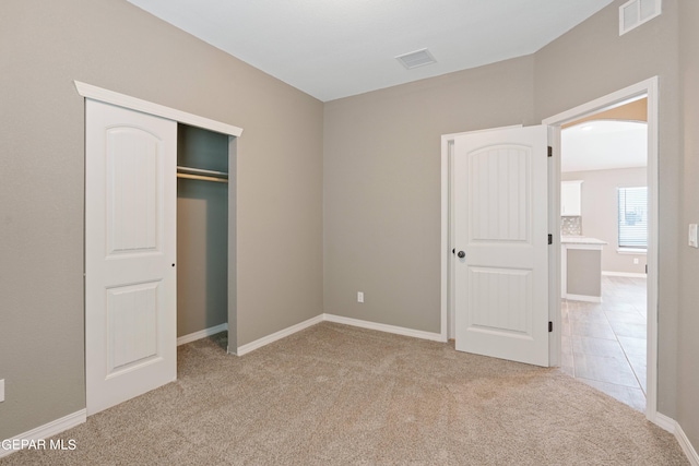 1329 Madero Ave, El Paso, TX 79928 - unfurnished bedroom with carpet, a closet, baseboards, and arched walkways