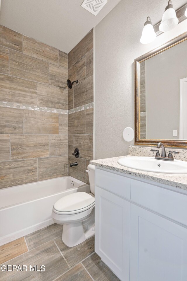 1329 Madero Ave, El Paso, TX 79928 - bathroom with vanity, toilet, and  shower combination