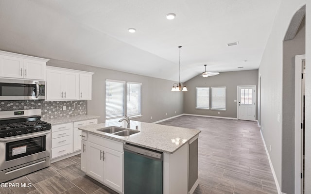 1329 Madero Ave, El Paso, TX 79928 - kitchen featuring stainless steel appliances, a sink, lofted ceiling, plenty of natural light, and ceiling fan