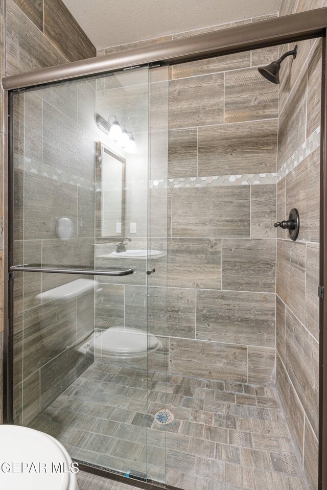 1329 Madero Ave, El Paso, TX 79928 - bathroom with toilet and a shower stall