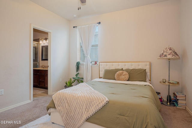 1916 William Caples St, El Paso, TX 79938 - bedroom with carpet, ensuite bathroom, baseboards, and ceiling fan