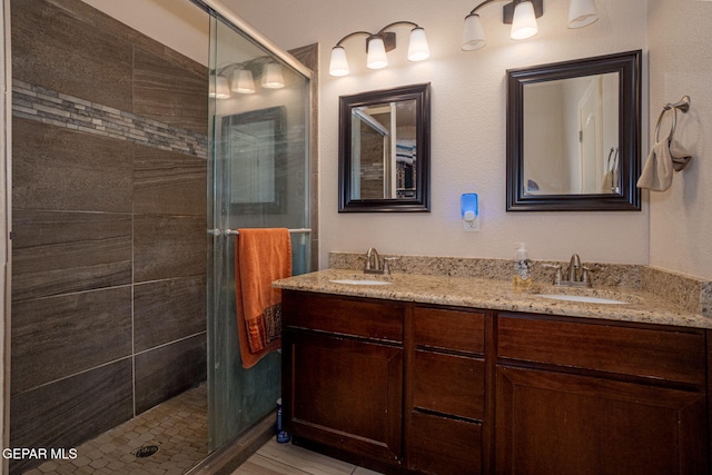1916 William Caples St, El Paso, TX 79938 - bathroom featuring a shower stall and double vanity