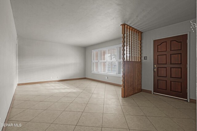 904 Apple Ln, El Paso, TX 79925 - foyer with baseboards and light tile patterned floors