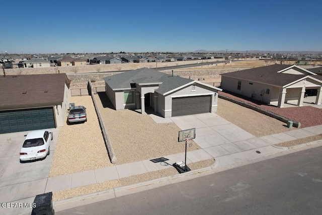 14573 Banana Yucca Ave, Horizon City, TX 79928 - view of front of property featuring concrete driveway, a residential view, and a garage