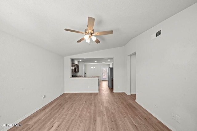 14573 Banana Yucca Ave, Horizon City, TX 79928 - unfurnished living room featuring light wood-type flooring, ceiling fan, and baseboards