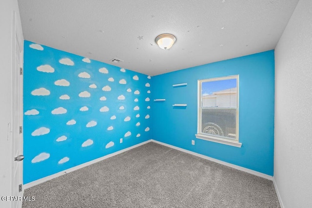 14573 Banana Yucca Ave, Horizon City, TX 79928 - empty room with carpet, baseboards, and a textured ceiling