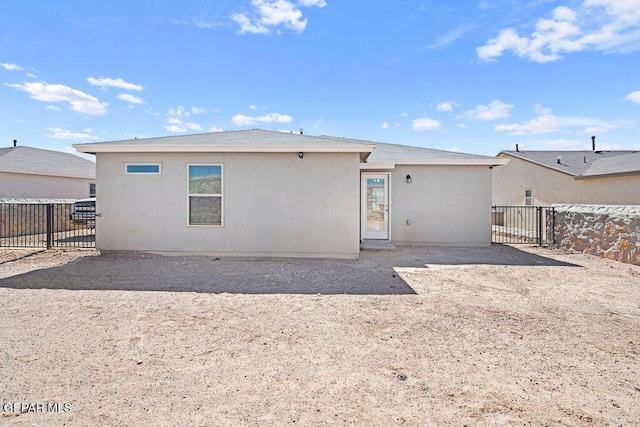 14573 Banana Yucca Ave, Horizon City, TX 79928 - rear view of property with a fenced backyard and stucco siding