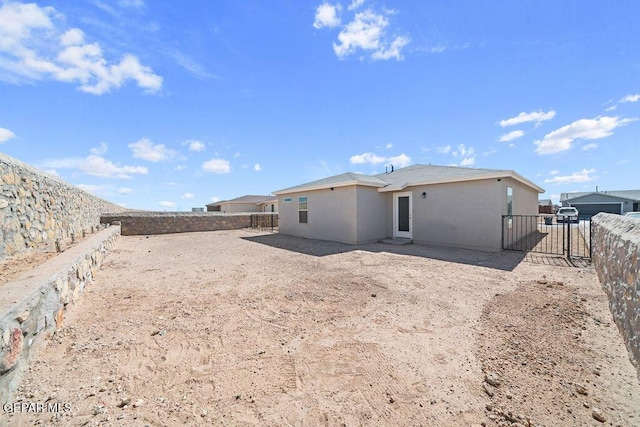 14573 Banana Yucca Ave, Horizon City, TX 79928 - back of property featuring a fenced backyard and stucco siding