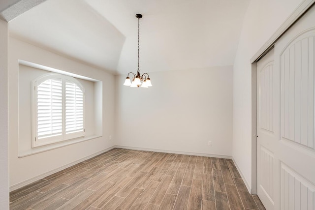 13852 Summer Wave Ave, El Paso, TX 79928 - spare room with light wood-style floors, lofted ceiling, a chandelier, and baseboards