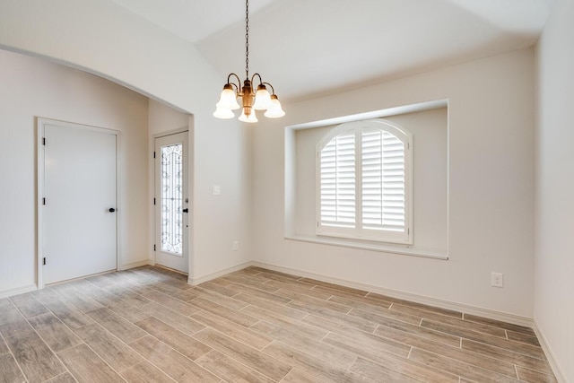13852 Summer Wave Ave, El Paso, TX 79928 - spare room with a chandelier, light wood finished floors, and baseboards