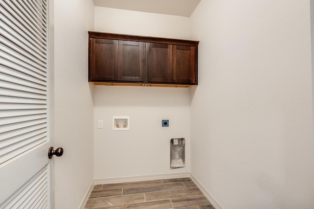 13852 Summer Wave Ave, El Paso, TX 79928 - laundry room with electric dryer hookup, hookup for a washing machine, wood finished floors, baseboards, and cabinet space