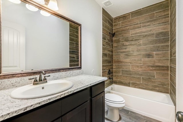 13852 Summer Wave Ave, El Paso, TX 79928 - bathroom featuring vanity, toilet, bathing tub / shower combination, and wood finished floors