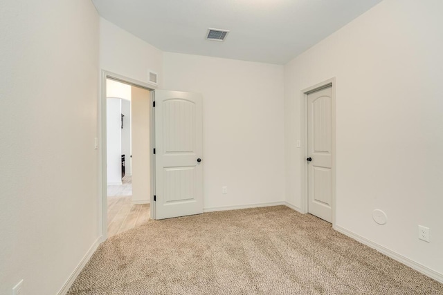 13852 Summer Wave Ave, El Paso, TX 79928 - unfurnished bedroom featuring light carpet and baseboards