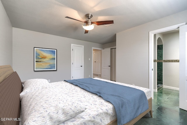 5814 Beaumont Pl, El Paso, TX 79912 - bedroom with baseboards, concrete flooring, and a ceiling fan