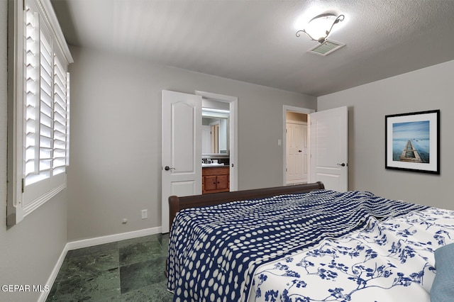 5814 Beaumont Pl, El Paso, TX 79912 - bedroom with baseboards and dark stone finish flooring