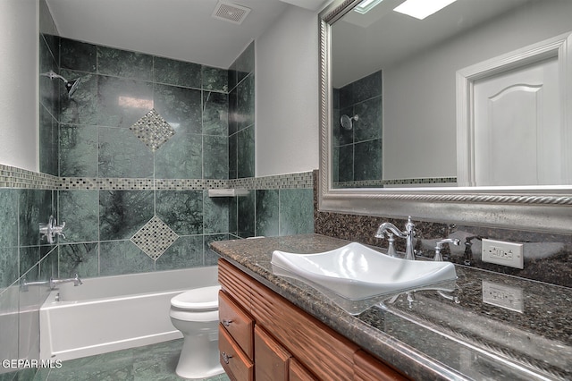 5814 Beaumont Pl, El Paso, TX 79912 - bathroom with vanity, toilet,  shower combination, and tile walls