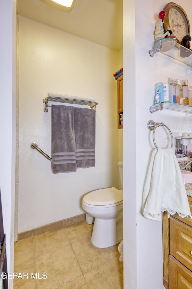 10605 Park View Cir, El Paso, TX 79935 - bathroom with toilet, tile patterned floors, and baseboards