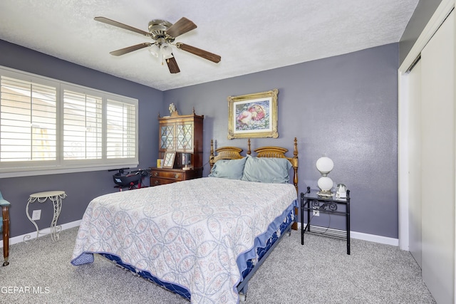 10605 Park View Cir, El Paso, TX 79935 - carpeted bedroom featuring baseboards, ceiling fan, a textured ceiling, and a closet